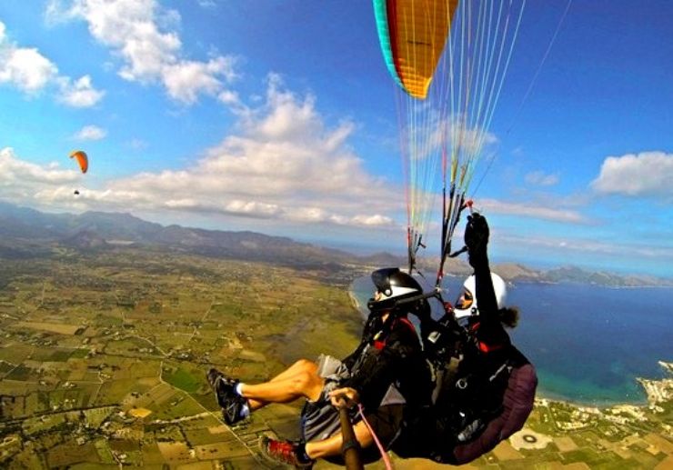 Tandem paragliding over Mallorca coastline