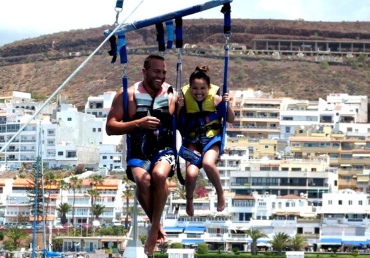 father and daughter parascending in Tenerife