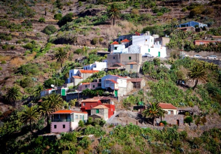 Houses on the green slope of Masca gorge in Tenerife