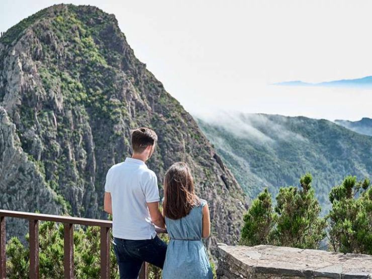 Couple in La Gomera admiring the impressive scenery from a viewpoint