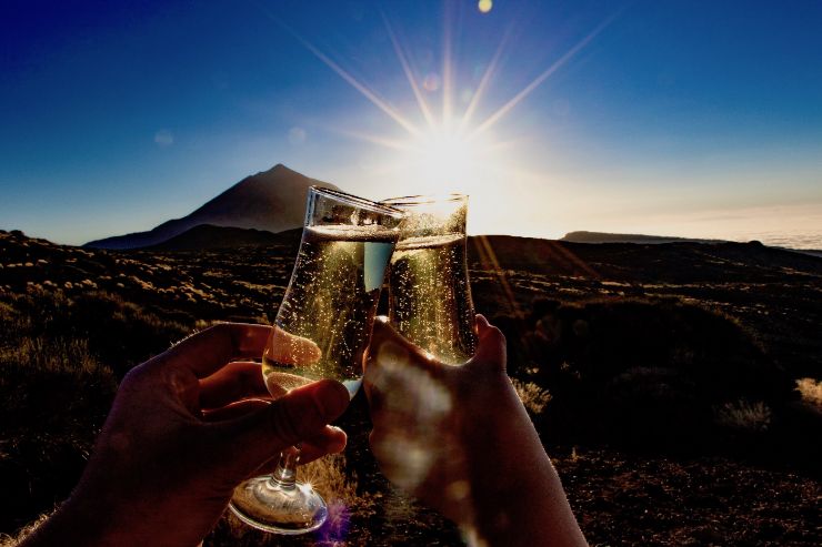 Cheers to the sunset with a sparkling wine