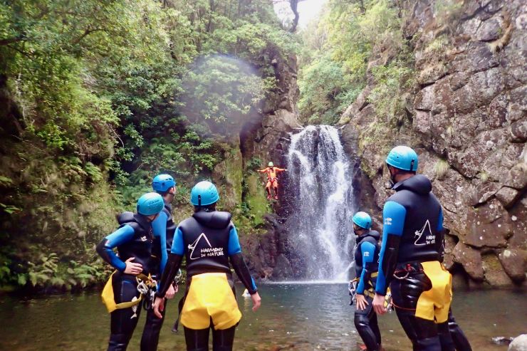 Canyoning in Madeira jumping down waterfall